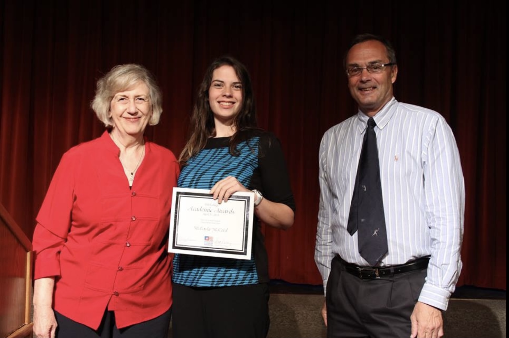 McCord receiving an award from Hill College choir director, Shirley Erickson, at the college's 2015 Spring Fling.