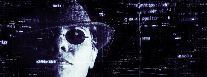 Cyber Security Banner of a hacker with data characters floating around him/her.