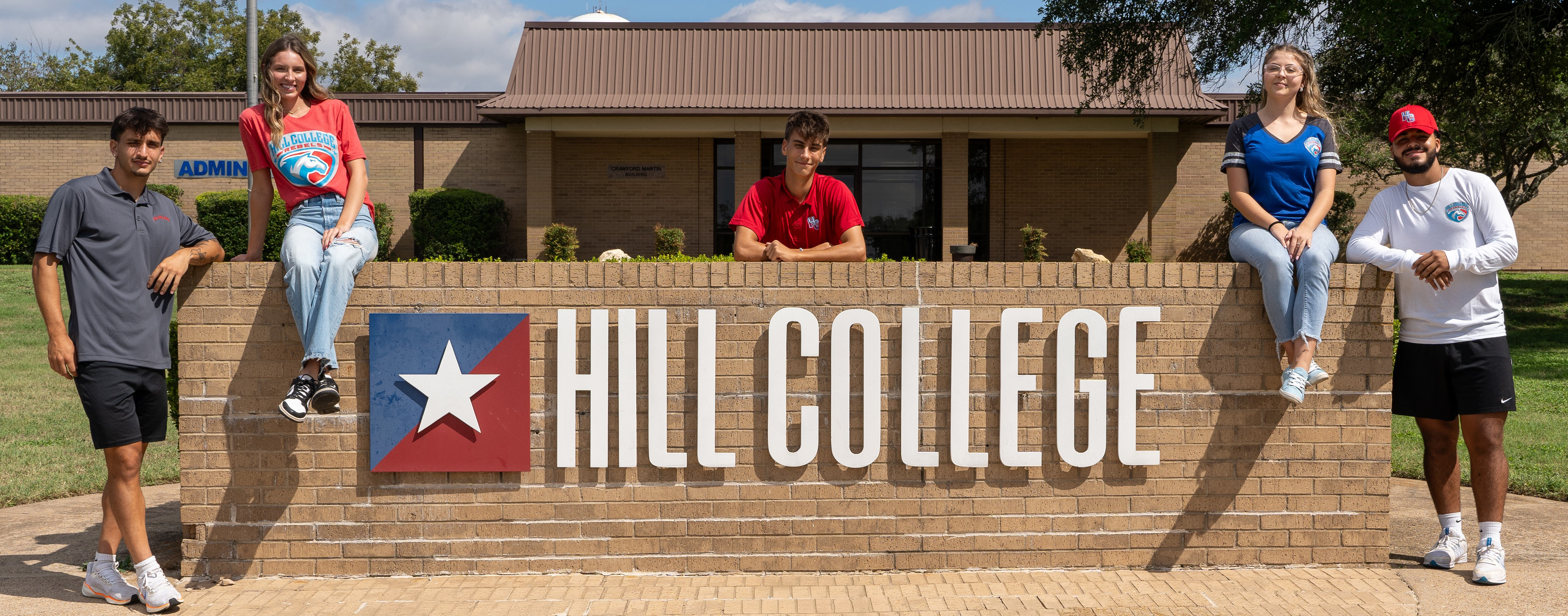 Students in front of Hill College monument