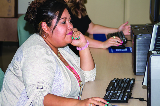 Student typing on a computer