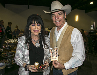 Couple attending 2022 Boots & Suits event